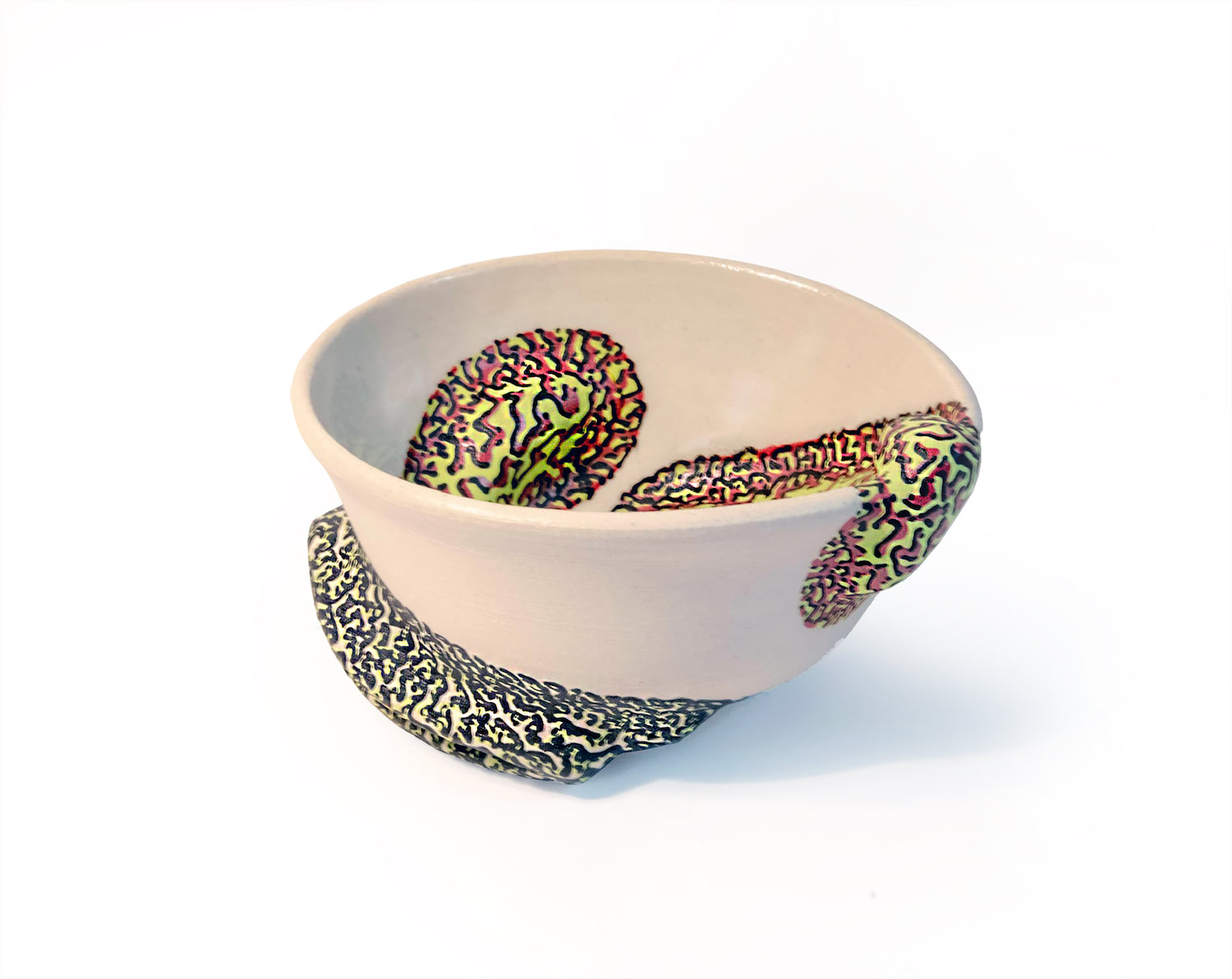 An image of a white bowl form with a light green, red, and black line pattern that covers sculptural surface additions that move from the exterior to the interior.