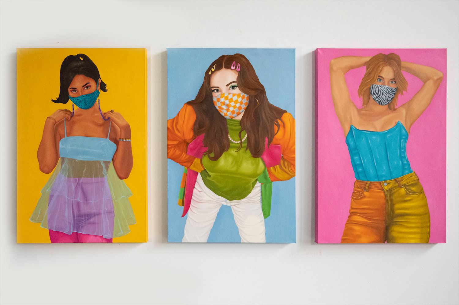 Installation view of triptych portraying three women in their quarantine best.