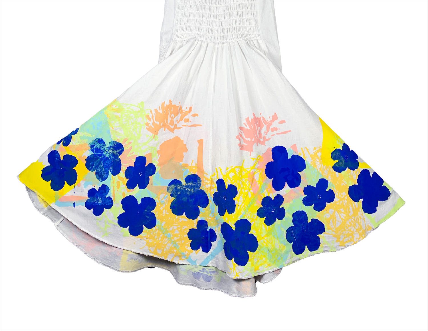 image of dress with colorful print splatters printed around bottom, prints of dark blue flowers stand out the most