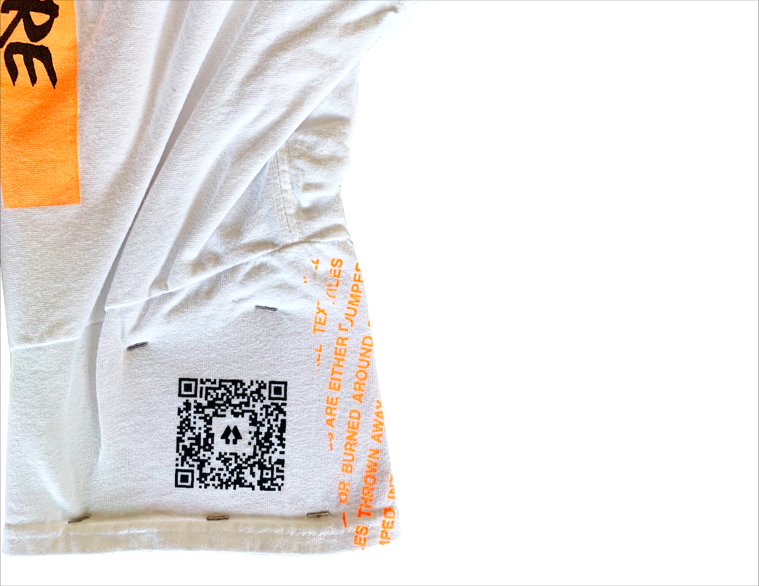 image of a QR code printed on the sleeve of the graffiti print shirt.